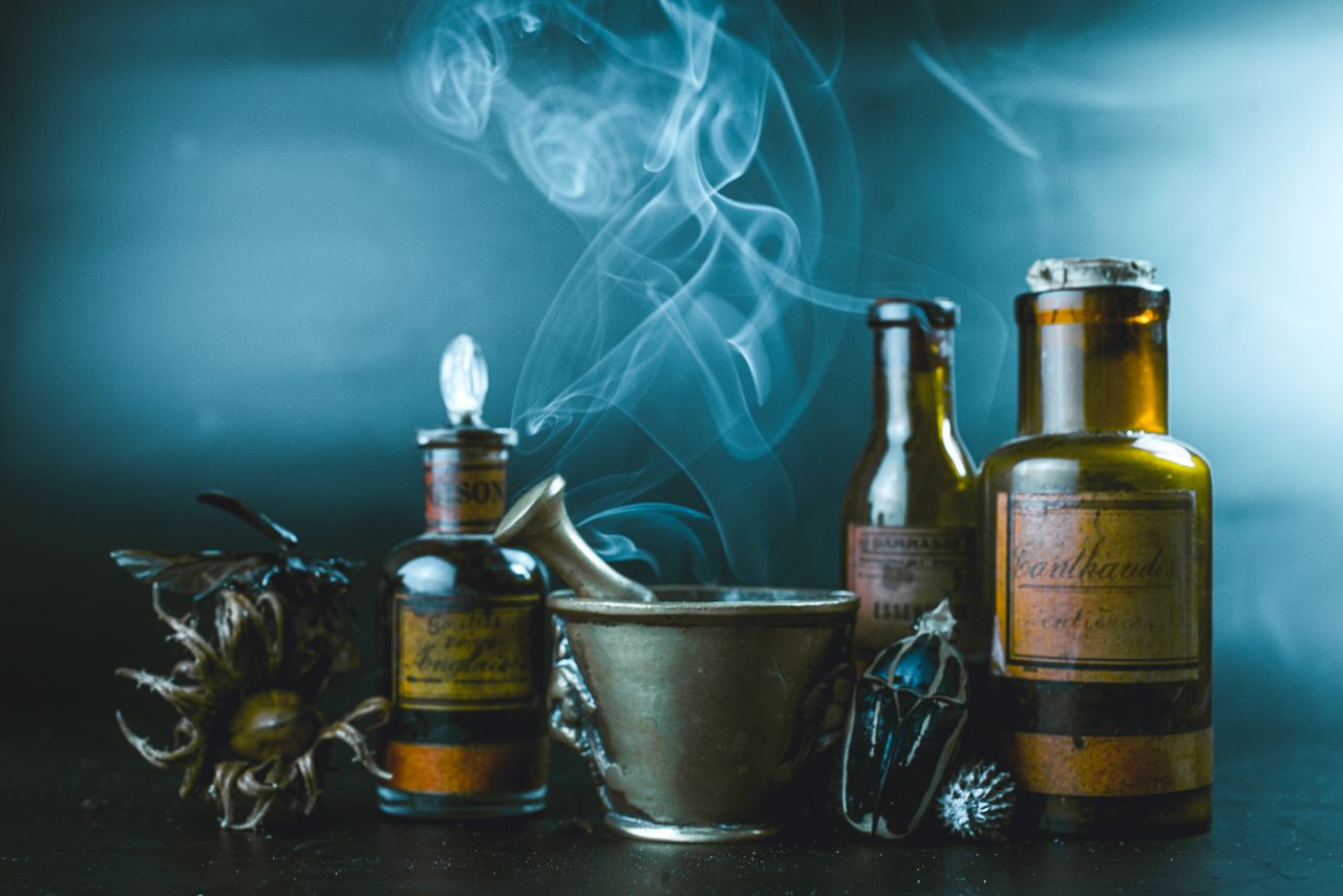 Crafting Captivating Headlines: Your awesome post title goes here Vintage apothecary bottles with rising smoke, evoking a sense of mystery and traditional medicine.
